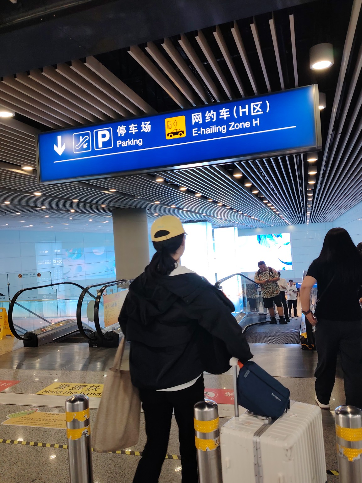 Walking toward ground transportation at Beijing airport